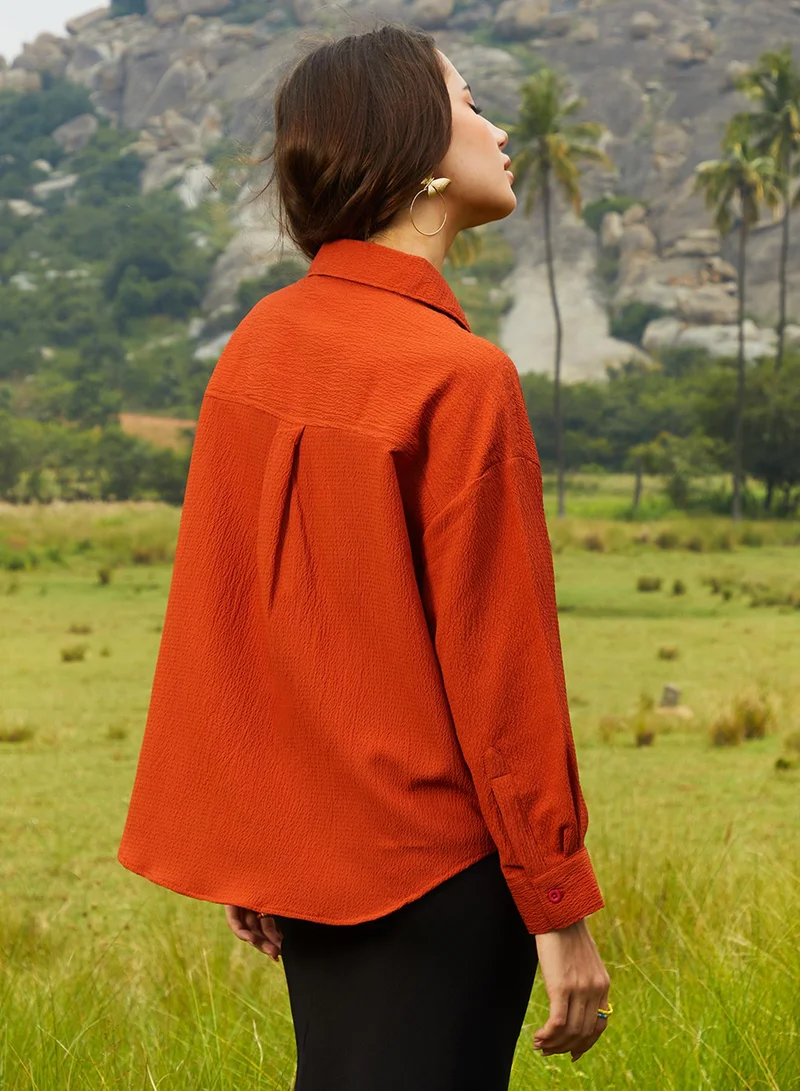 Campus Sutra  Women's Rust Orange Textured Oversized Shirt For Casual Wear | Spread Collar | Long Sleeve | Button Closure | Oversized Shirt Crafted With Comfort Fit For Everyday Wear for Women | Best Price UAE
